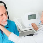 Doctor testing patient's hearing